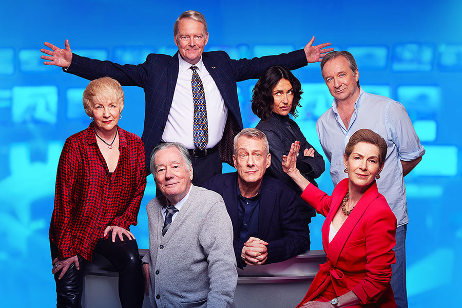 Drop the Dead Donkey cast pose against a blue background
