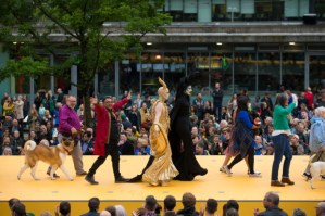 Mancunians strut down huge yellow catwalk for opening event of Manchester International Festival