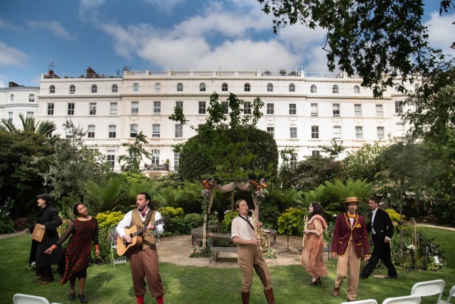 A group of actors performing Twelfth Night outdoors