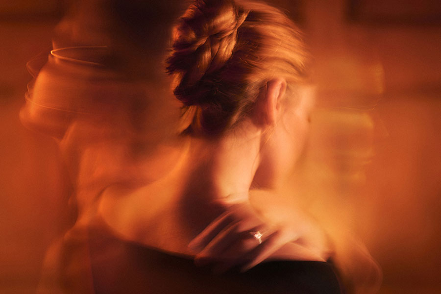 The Duchess of Malfi artwork showing a woman holding her shoulder