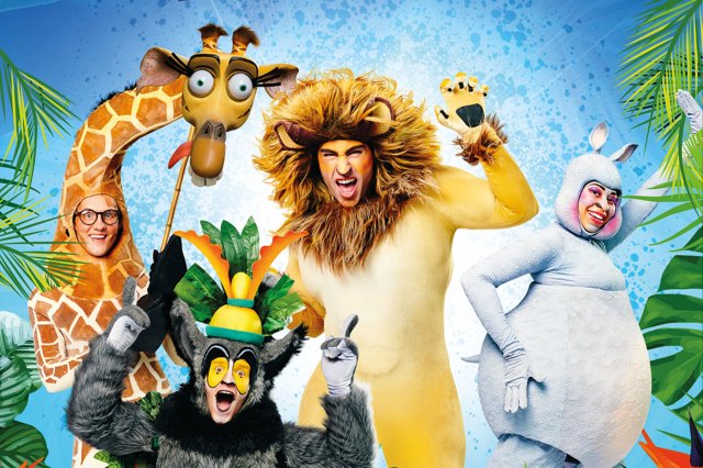 Actors dressed as Melman, King Julien, Alex and Gloria pose from the Madagascar franchise pose in a jungle