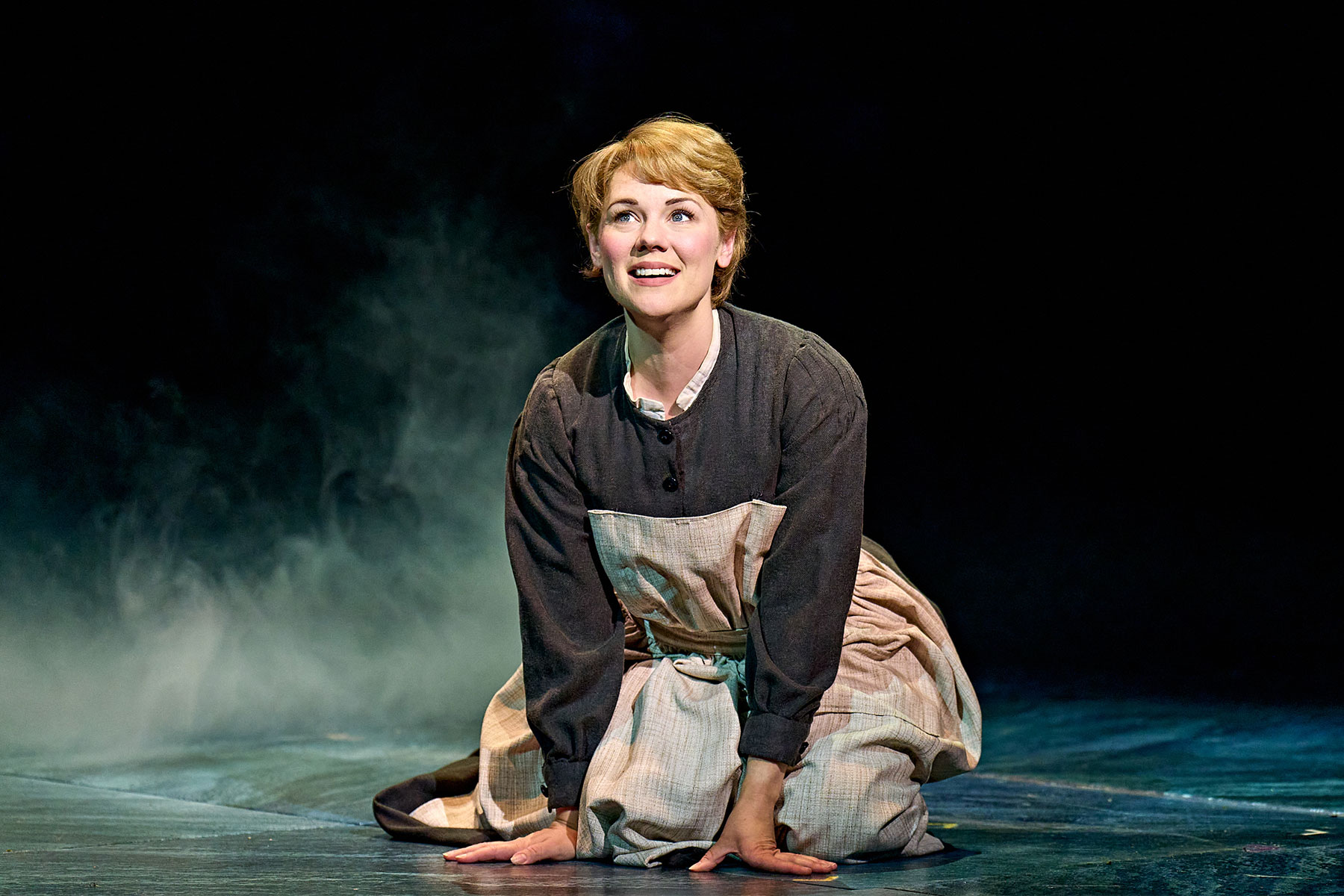 Gina Beck on stage as Maria in The Sound of Music