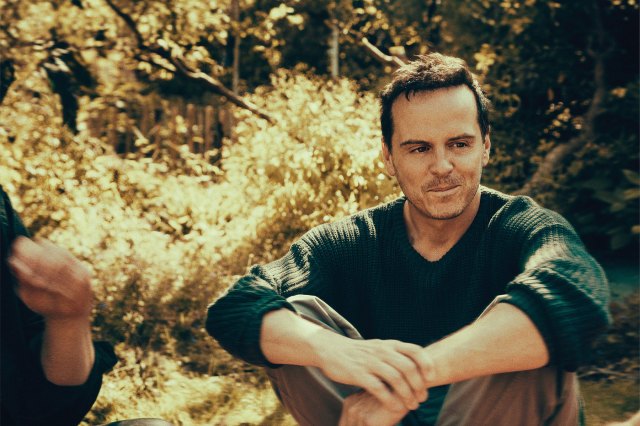 Andrew Scott sitting in a woodland space