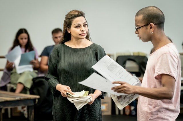 Ayesha Dharker (Aai), Hiran Abeysekera (Nathuram Godse) and company in rehearsal for The Father and the Assassin at the National Theatre 2023. Credits Marc Brenner 0379 Ayesha Dharker, Hiran Abeysekera and company in rehearsal for The Father and the Assassin at the National Theatre