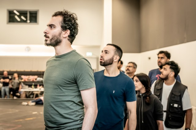 Hari Mackinnon (Madhav), Johndeep More (Ensemble) and company in rehearsal for The Father and the Assassin at the National Theatre 2023. Credits Marc Brenner 6113 Hari Mackinnon, Johndeep More and company in rehearsal for The Father and the Assassin at the National Theatre
