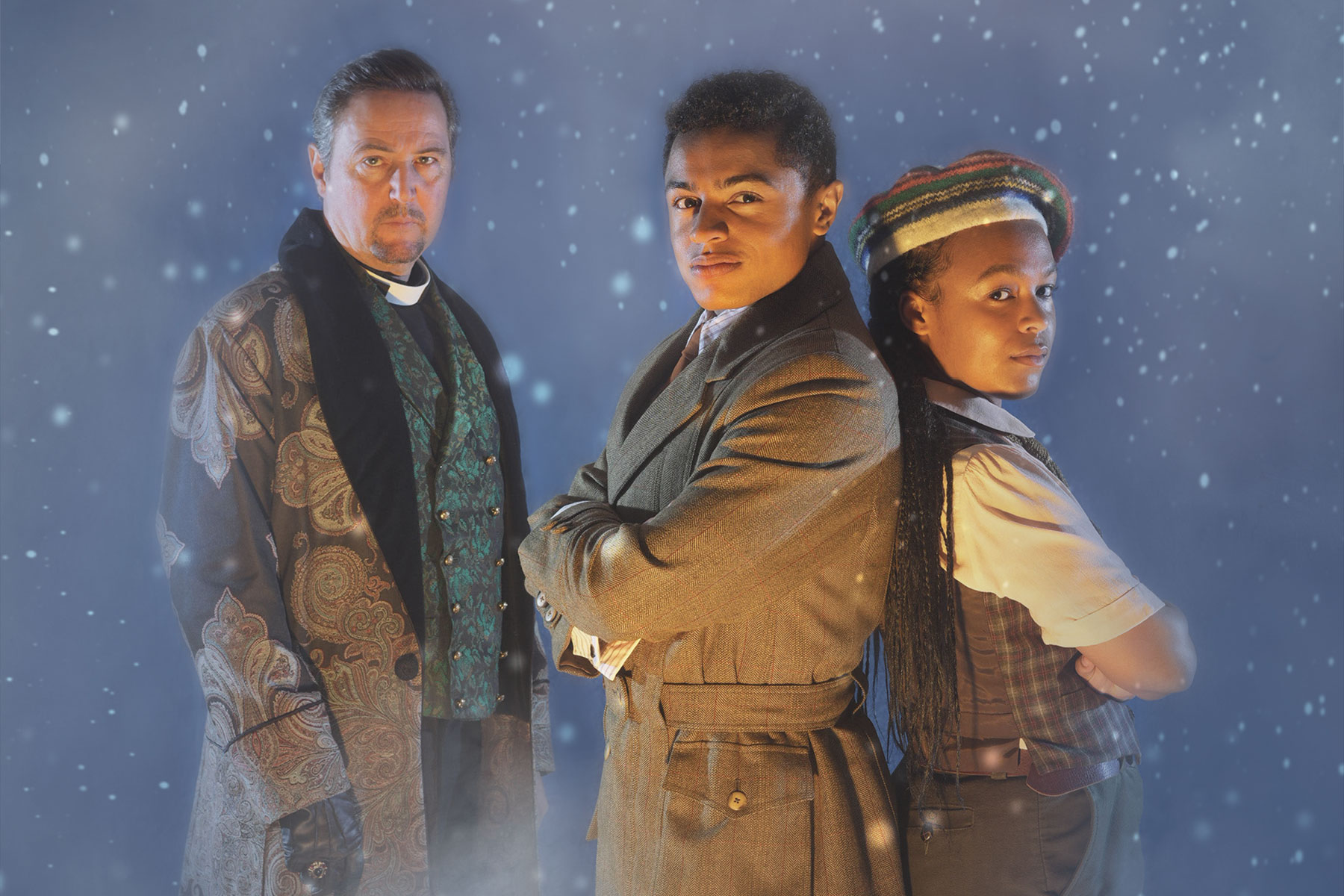 Richard Lynch as Abner, Callum Balmforth as Kay Harker and Mae Munuo as Maria Jones in a promotional image for The Box of Delights