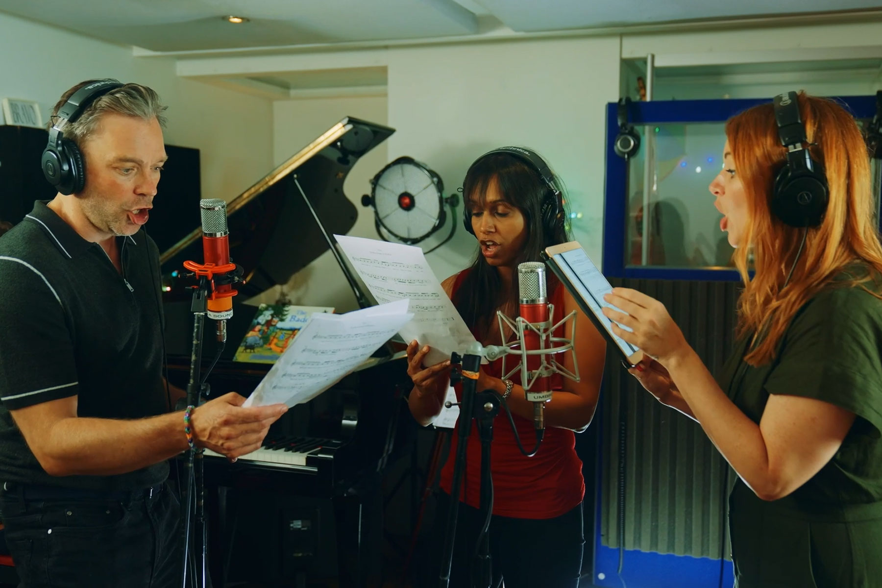 Hadley Fraser, Sumudu Jayatilaka and Laura Tebbutt in a recording studio