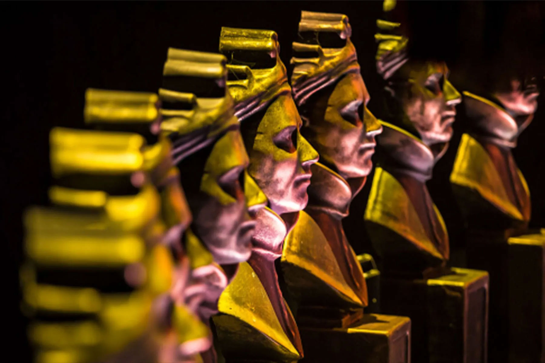 A row of Olivier Awards statues