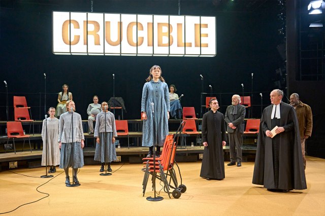 Millicent Wong (as Mary Warren) and the oompany in a scene from The Crucible at the Crucible Theatre in Sheffield