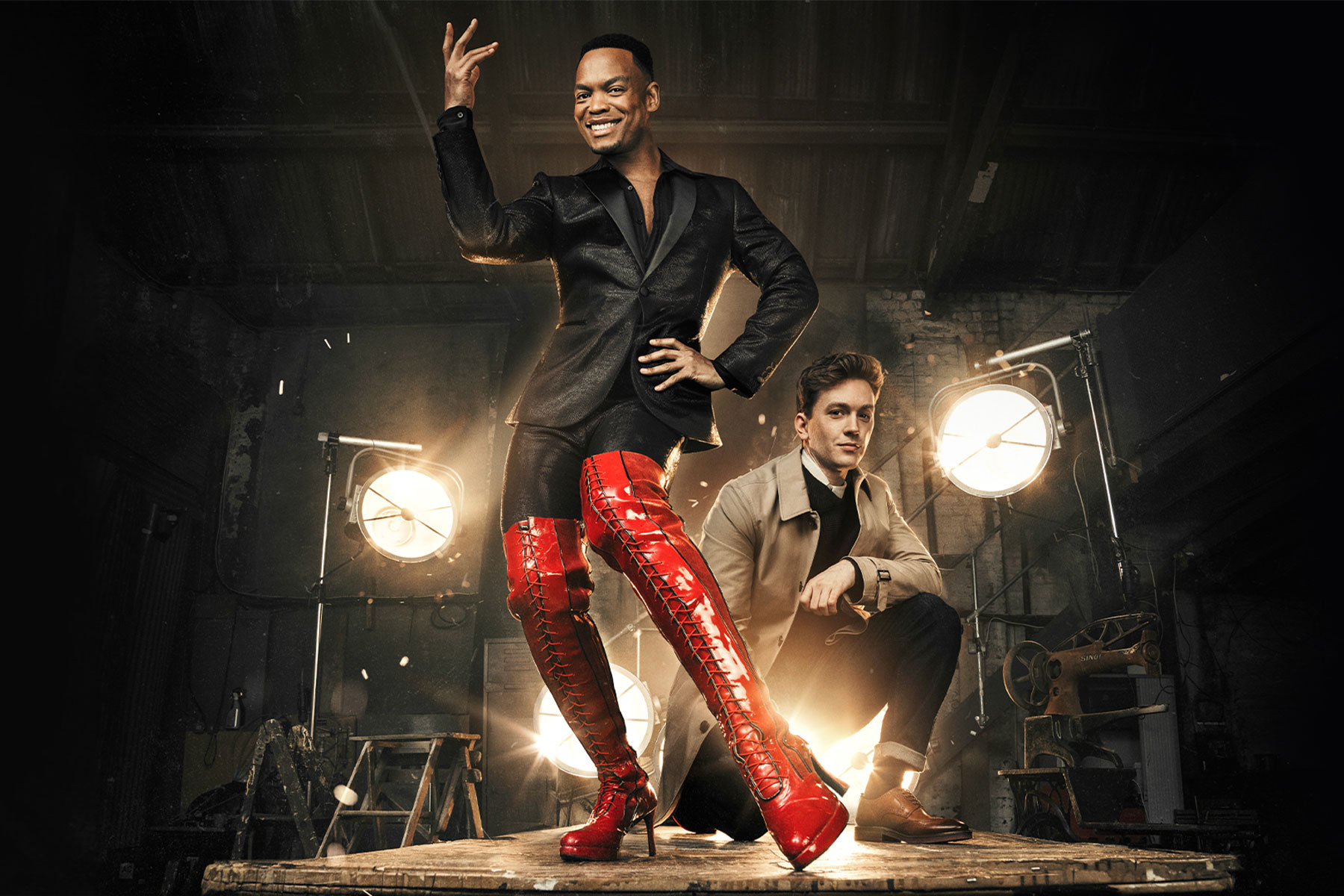 A promotional image for Kinky Boots featuring Johannes Radebe as Lola and Dan Partridge as Charlie Price