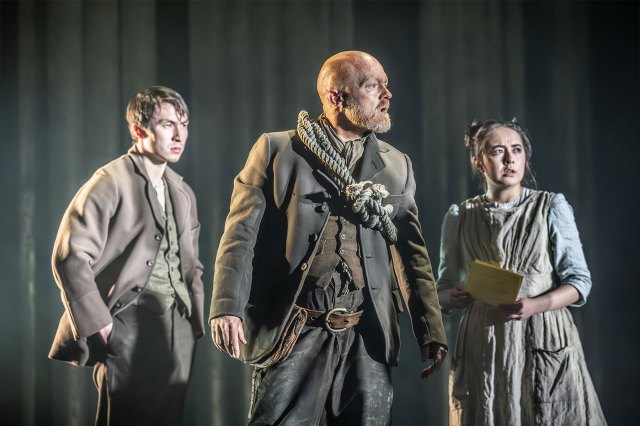 Brandon Grace (as Charley Hexam), Jake Wood (as Gaffer Hexam) and Ami Tredrea (as Lizzie Hexam) in London Tide at the National Theatre