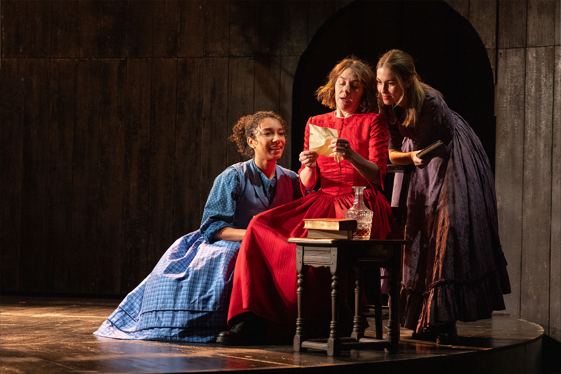 Adele James (as Emily Brontë), Gemma Whelan (as Charlotte Brontë) and Rhiannon Clements (as Anne Brontë) in a scene from Underdog: The Other Other Brontë at the National Theatre