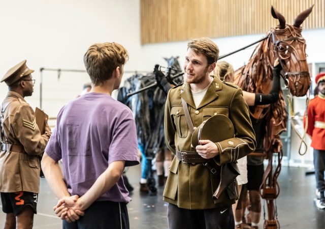 Chris Williams and the cast of War Horse in rehearsals. Credit Pamela Raith Photography. 110