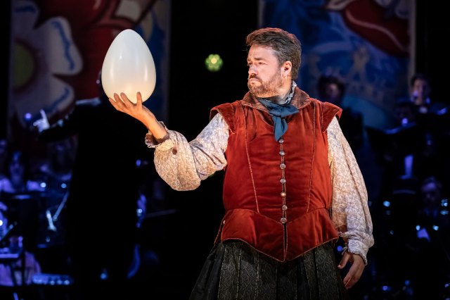 Jason Manford (as Nick Bottom) holding a large egg in Something Rotten! in Concert at Theatre Royal Drury Lane