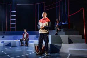 Gavo Singh Chera, Brian Vernel and Vivienne Achaempong in Pins and Needles at the Kiln Theatre