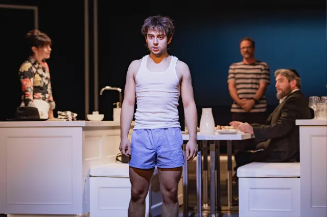 Gabriel Howell stands in a vest and boxer shirts during a scene from What We Talk About When We Talk About Anne Frank at Marylebone Theatre