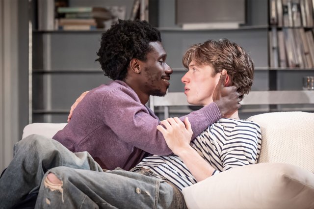 Michael Ahomka-Lindsay (as Jonathan) and Jack Gibson (as Wes) embrace in a scene from Reverberation at Bristol Old Vic