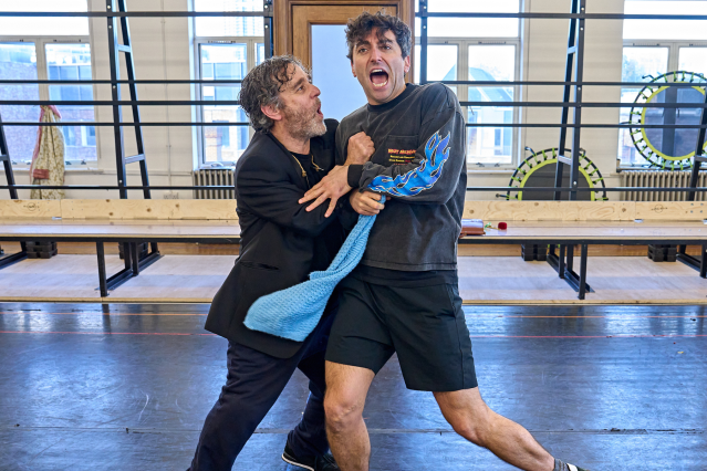 Two performers in a rehearsal room