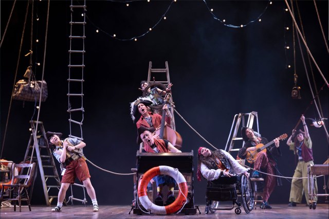 A group of actors on stage dressed as pirates from Treasure Island