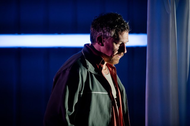 The side profile of an actor on stage