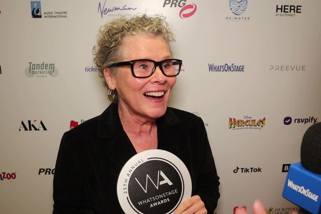 Actor Imelda Staunton holding a WhatsOnStage Award trophy