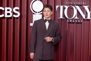 One last stroll down Sunset Boulevard: Tom Francis finishes his final lap in front of a Broadway crowd