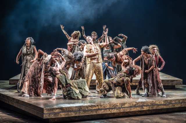 Ukweli Roach (Dionysos) and the company of Bacchae at the National Theatre. Photographer Marc Brenner ONE 03766