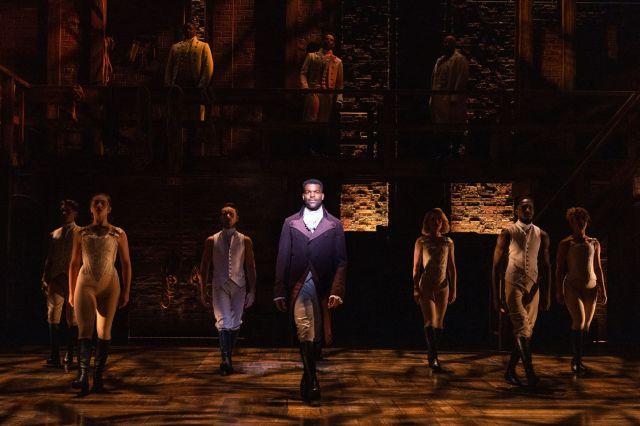 Jay Perry as Aaron Burr and the Hamilton company,
