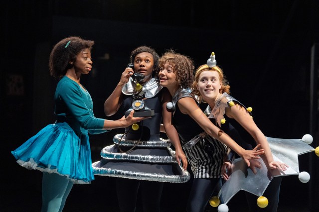 Anu Ogunmefun (Ensemble), Nina Cassells (Pauline), Sienna Arif Knights (Petrova) and Scarlett Monahan (Posy) in Ballet Shoes (2025) at the National Theatre. (c) Alastair Muir BS15971