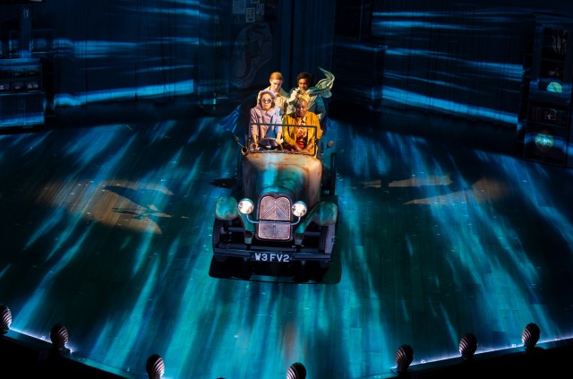 Sienna Arif Knights (Petrova), Scarlett Monahan (Posy), Nina Cassells (Pauline) and Nadine Higgin (Theo Dane) in Ballet Shoes (2025) at the National Theatre. (c) Alastair Muir BS02978