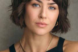 Millie Mayhew, provided uncredited